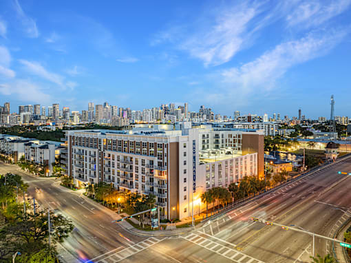 a view of the city from a high rise building with a street