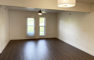 Living Room with Hard-Surface Flooring at Byron Lakes Apartments in Byron Center, MI