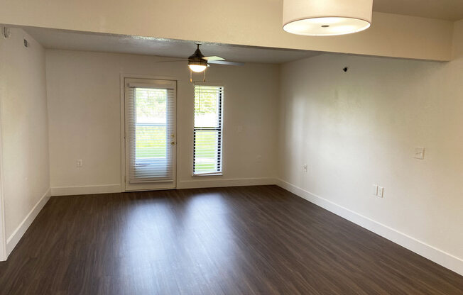 Living Room with Hard-Surface Flooring at Byron Lakes Apartments in Byron Center, MI
