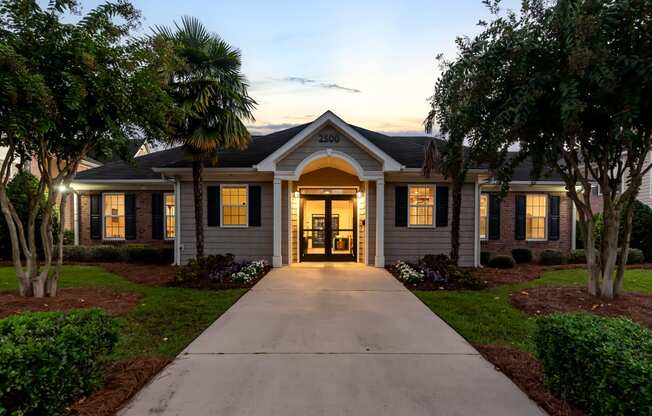 the front of a house with a walkway leading up to it