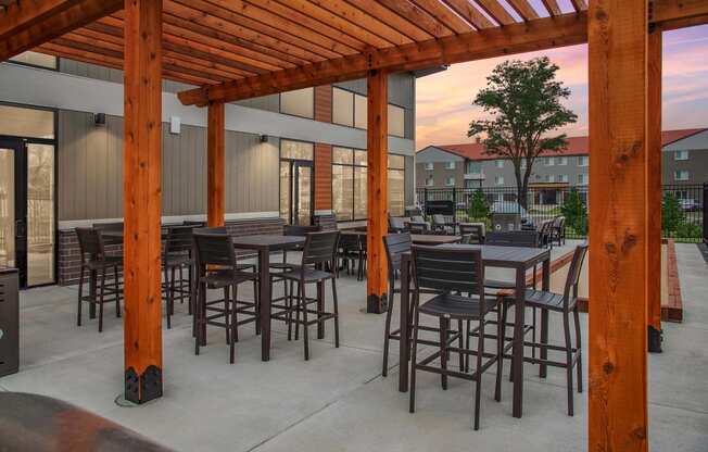 Outdoor deck with beautiful wood pergolas shading plenty of outdoor seating.