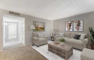 a living room with a couch and a coffee table at Acacia Gardens, Albuquerque, New Mexico