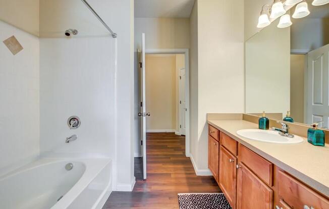 One-Bedroom Apartments in San Antonio TX - Club at Stone Oak Large Bathroom with Stainless Steel Fixtures, Shower, Large Vanity, Plenty of Counterspace, and Much More