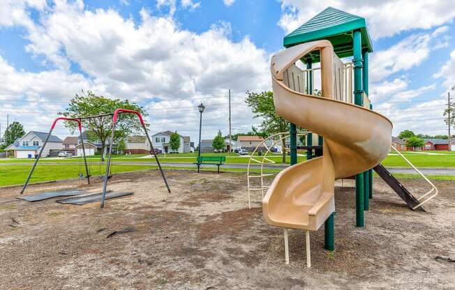 a slide in a playground at a park