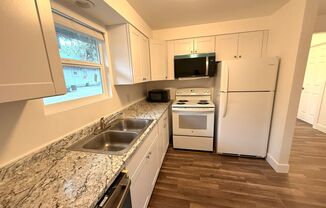 CHECK OUT THIS COMFORTABLE TRIPLEX UNIT LOCATED IN THE OLD MILL DISTRICT