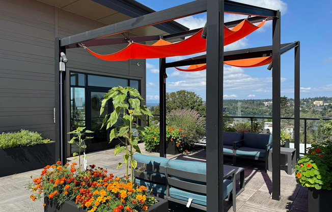 a canopy on a roof terrace with a view of the city at Spyglass Hill Apartments, Washington