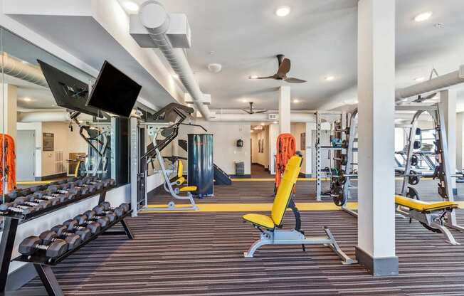 free weights and cardio machines at the enclave at woodbridge apartments in sugar land, tx