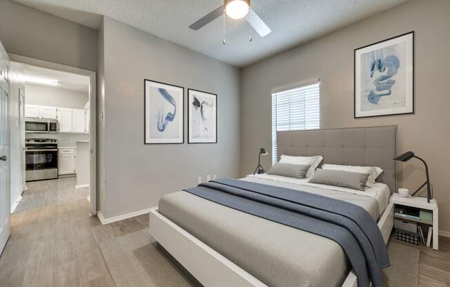 a bedroom with a bed and a ceiling fan at Foxborough Apartments, Irving, TX, Texas, 75061