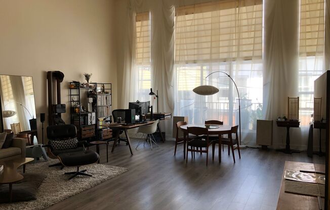 Looking for space? Perfect work from home huge loft w/lots of light, huge windows, high ceilings, parking, storage and roofdeck!