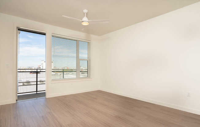 Living Room with Balcony and Hard Surface Flooring