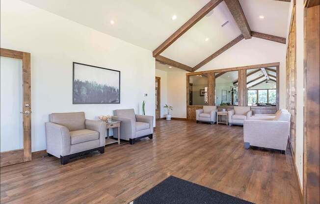 A living room with wooden floors and furniture at Riverplace Apartment Homes, Independence, 97351