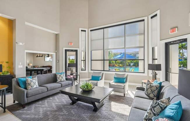 A living room with a grey couch and a coffee table.