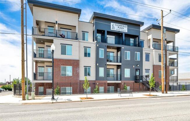 an apartment building on the side of a street