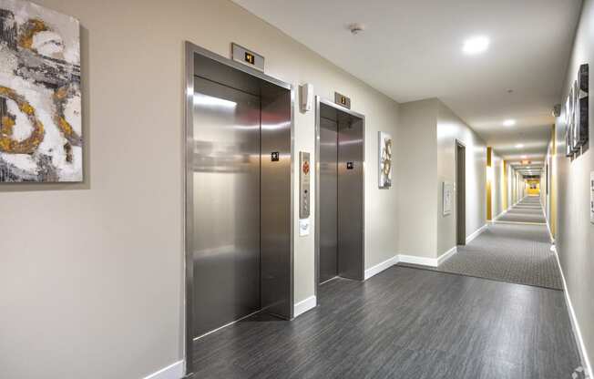a row of elevators in a hallway in a building