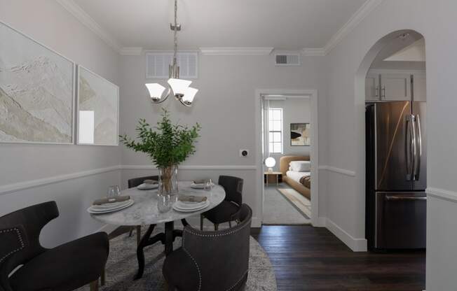 a kitchen and dining room with a table and chairs