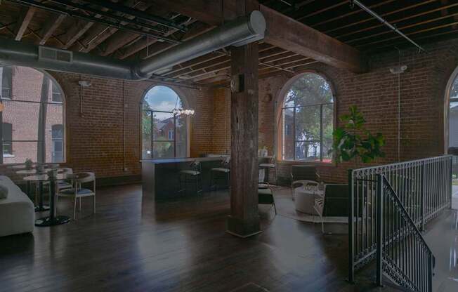 A large open space with a high ceiling and wooden floors.