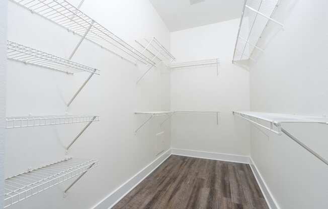 Large walk in closet with shelves