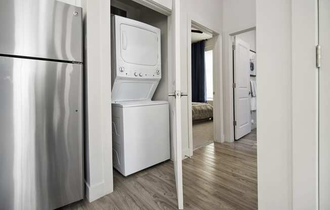a room with a washer and dryer in it at 200 City View, Utah
