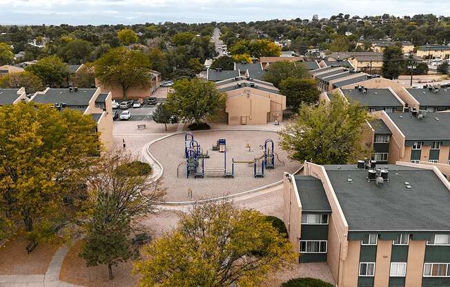 an aerial view of a playground in the middle of a city