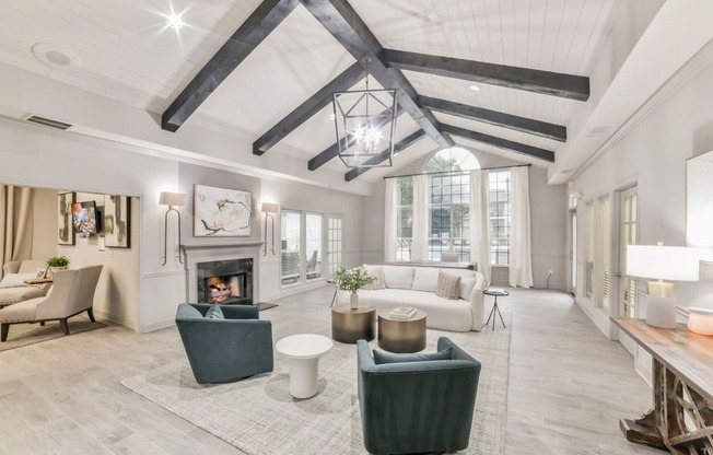 a living room with couches and chairs and a fireplace at Twenty35 at Timothy Woods, Athens