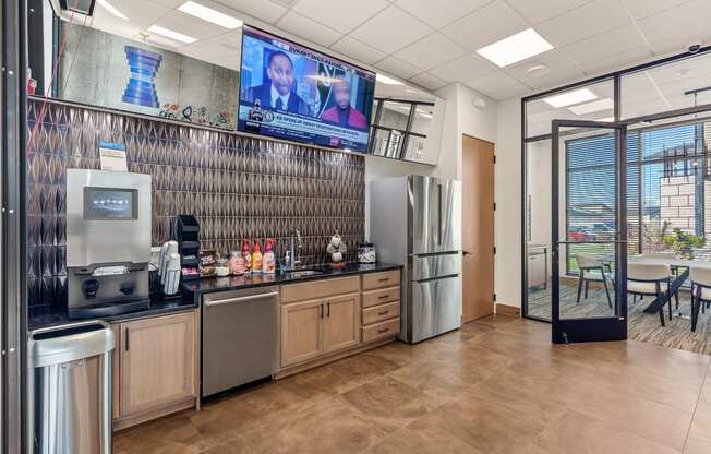 a kitchen with a refrigerator freezer next to a stove top oven