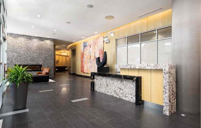 the lobby of a hotel with a reception desk