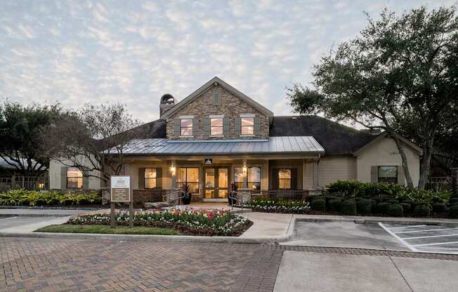 A house with a sign in front of it.