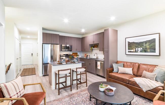 An open-concept apartment home at Modera University Park, where kitchen, dining, and living spaces come together for effortless everyday living.