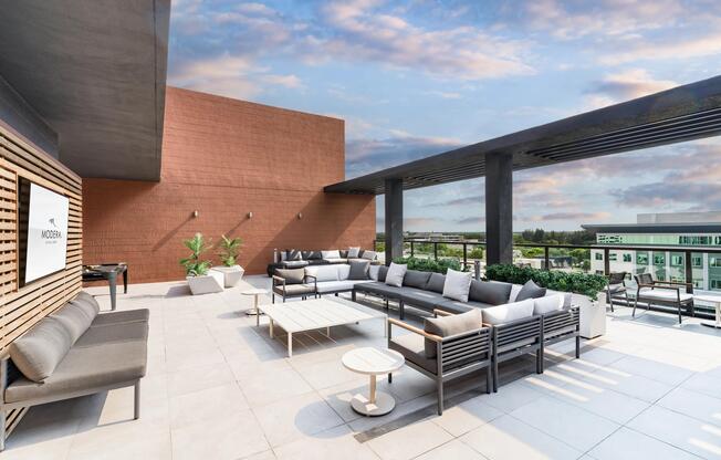 Rooftop terrace with shaded lounge seating, open-air gathering areas, and expansive views creating a comfortable setting for relaxation and conversation.