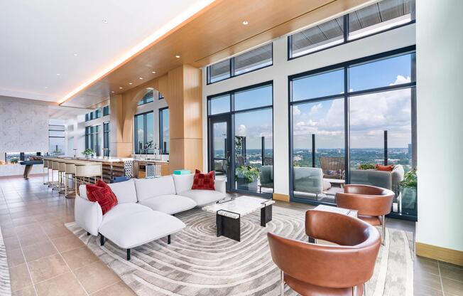 30th-floor social lounge with dramatic skyline panoramas, expansive seating areas, and seamless indoor-outdoor connections overlooking Atlanta.