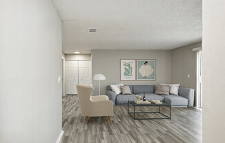 Model living room with chairs and sofa