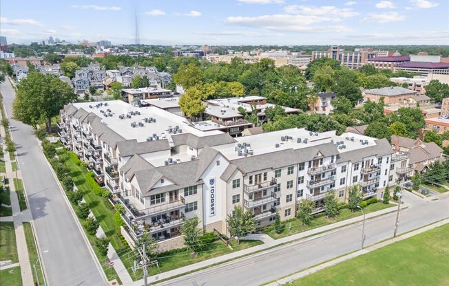 A large apartment complex with the word "Dormart" on the front.