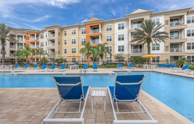 a blue pool of water in front of a building