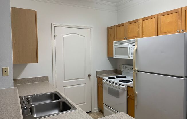 1/1 Ground Floor Unit with attached Garage!  Mirabella Condominiums