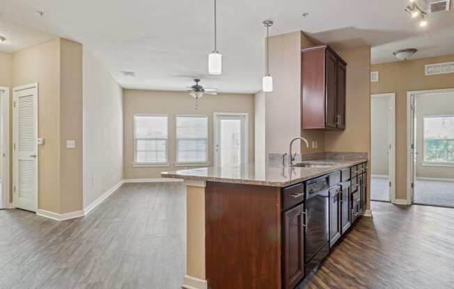 an empty kitchen with a large island in the middle