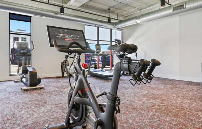 a gym with bikes and other exercise equipment