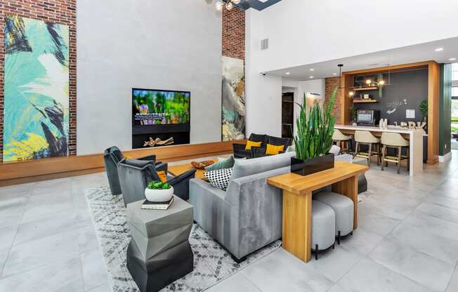 a living room filled with furniture and a flat screen tv