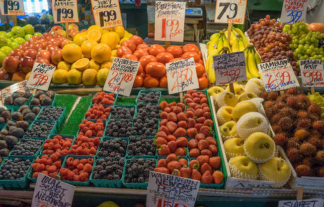 A fruit stand with a variety of fruits on display.