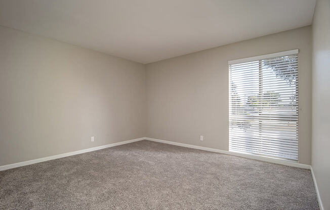 Living Room With Glass Door at Parc at 5 Apartments, Downey