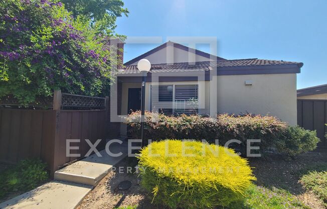 2/1 Single Story Condo With 2 Car Garage, Private Front & Back Patio & Updates Throughout!