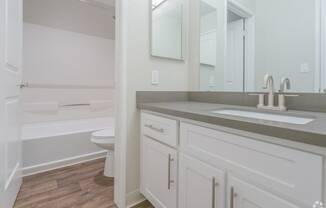 renovated bathroom grey countertops