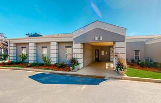 a building with the number 1000 on it and a blue sky