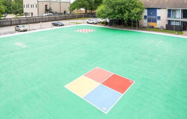 a basketball court on the roof of an apartment building