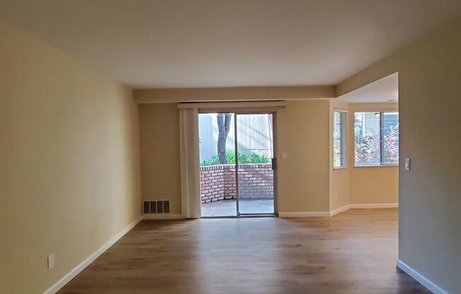 Spacious Downstairs Condo, New Wood Flooring, Fresh Paint, 1 Car Garage, Pool, Hot Tub, Patio!