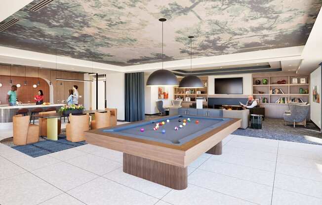 A billiard table is in the middle of a room with people standing around it.