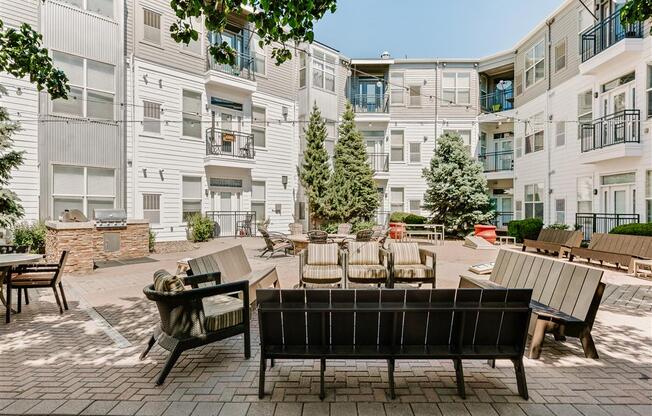 our apartments offer a spacious courtyard with furniture and tables