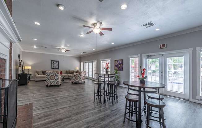 A spacious room with a ceiling fan and a couch.