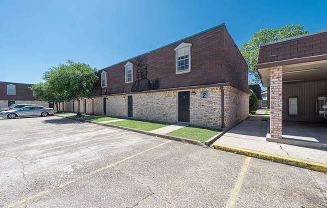 A parking lot with a building on the right.