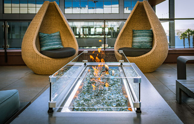 Outdoor Fireplace and Seating Area at AV8 Apartments in San Diego, CA