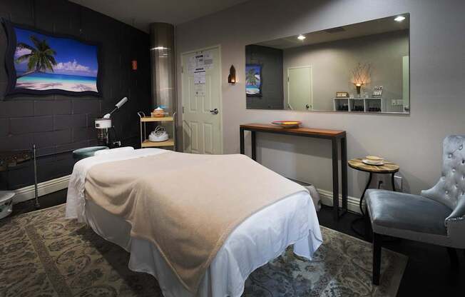 A room with a massage table and a chair. at La Jolla Crossroads Apartments, California